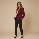 Yemelia burgundy single button blazer with structured fit, classic lapel, and flap pockets. Made from smooth fabric.