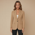 Yemelia camel brown single button tailored blazer with structured fit, classic lapels, and flap pockets.