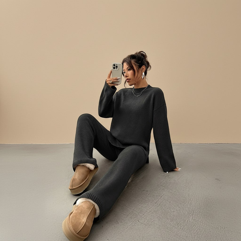Yemelia charcoal grey knit lounge set with relaxed fit sweater and wide leg pants. Soft knit fabric with ribbed cuffs and hem.