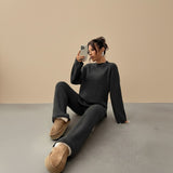 Yemelia charcoal grey knit lounge set with relaxed fit sweater and wide leg pants. Soft knit fabric with ribbed cuffs and hem.