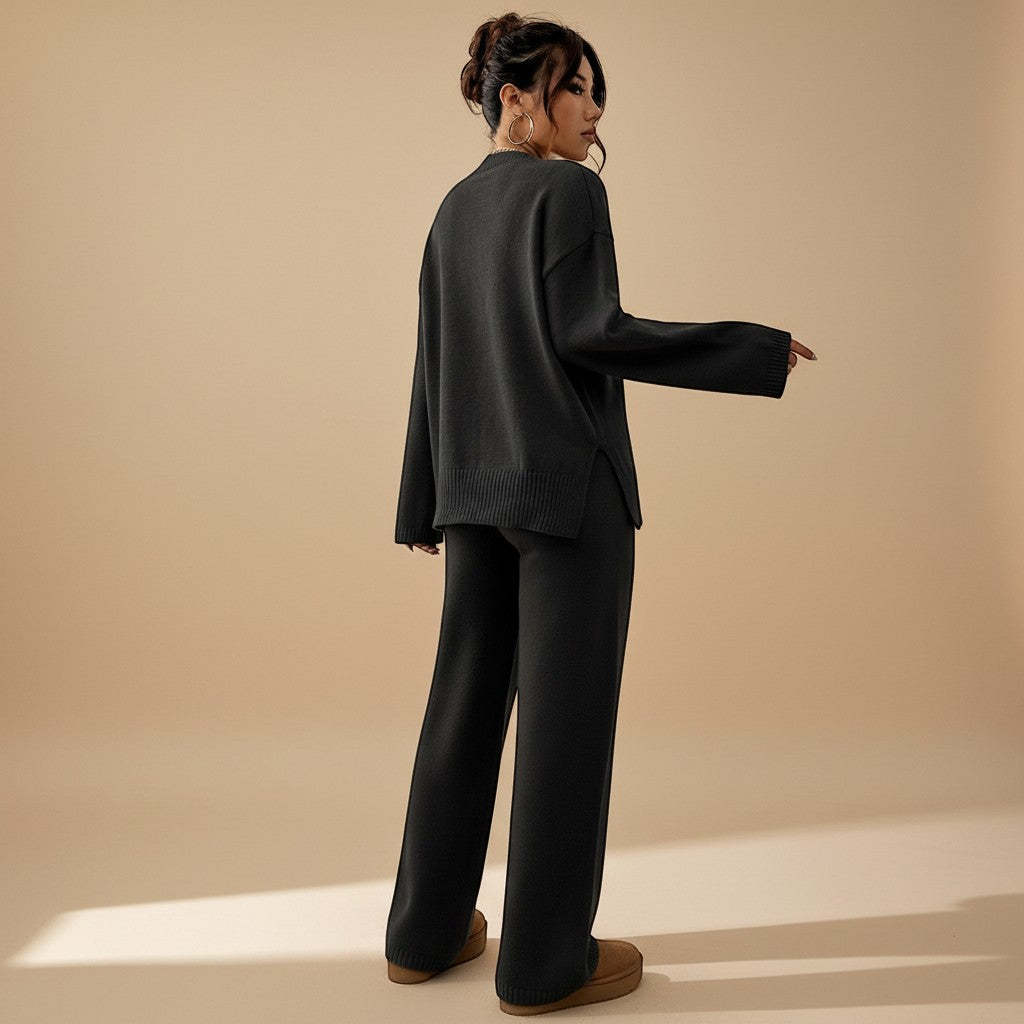 Yemelia charcoal grey knit lounge set with relaxed fit sweater and wide leg pants, ribbed cuffs and hem.