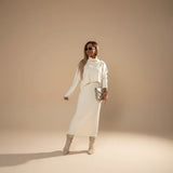 Yemelia cream knit turtleneck sweater and midi skirt set. Soft knit fabric, relaxed fit sweater, fitted skirt.