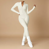 Yemelia cream long sleeve zip front sculpting one piece jumpsuit with full-length legs and high neckline.