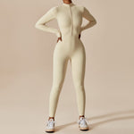 Yemelia cream long sleeve zip front sculpting one piece jumpsuit with full-length legs and high neckline.