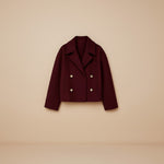 Yemelia cropped double-breasted tailored jacket in deep red with wide lapels and gold buttons.