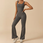 Yemelia dark grey sleeveless sculpting flared leg jumpsuit made of smooth stretch fabric.