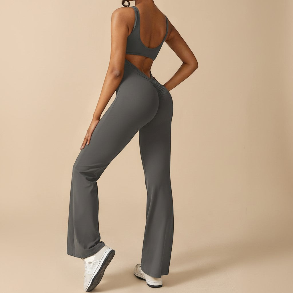 Yemelia dark grey sleeveless sculpting flared leg jumpsuit with ruched detail on back. Comfortable stretch fabric.