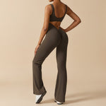 Yemelia sleeveless dark olive green sculpting flared leg jumpsuit with ruched detail on back.