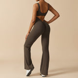 Yemelia sleeveless dark olive green sculpting flared leg jumpsuit with ruched detail on back.
