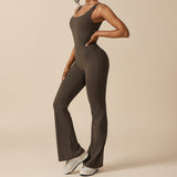 Yemelia sleeveless dark olive green sculpting flared leg jumpsuit made of smooth stretch fabric.