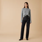 Yemelia dark wash denim wide leg pants with high waist and utility pockets, detailed with gold button accents.