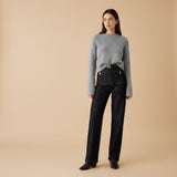 Yemelia dark wash denim wide leg pants with high waist and utility pockets, detailed with gold button accents.