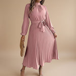 Yemelia dusty rose long sleeve pleated midi dress with high neck and waist tie. Elegant, flowing silhouette.
