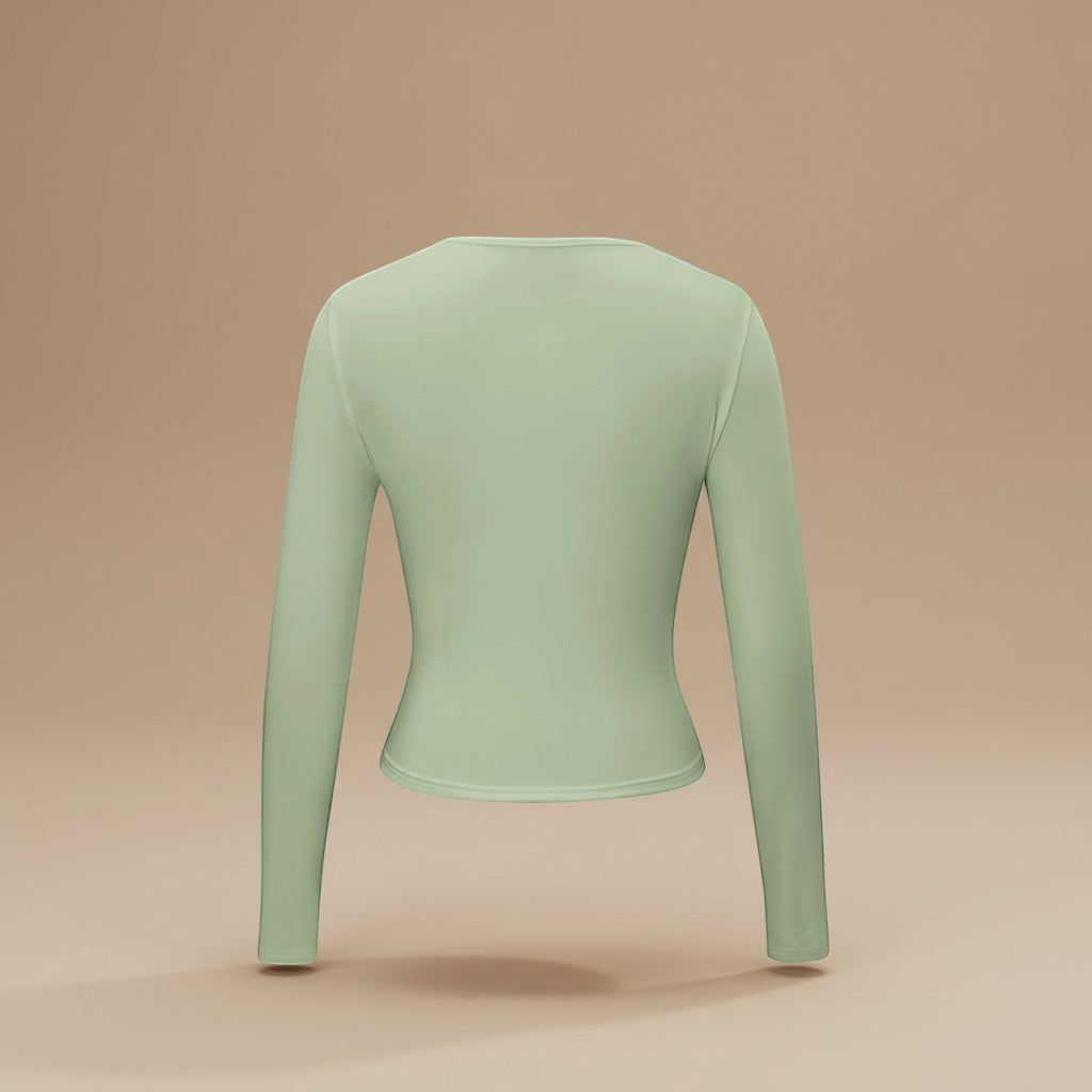 Yemelia light green long sleeve fitted crop top with thumbhole cuffs and a clean neckline, made from soft stretchy fabric.