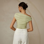 Yemelia light green ruched one-shoulder fitted top with asymmetrical neckline and stretch fabric.