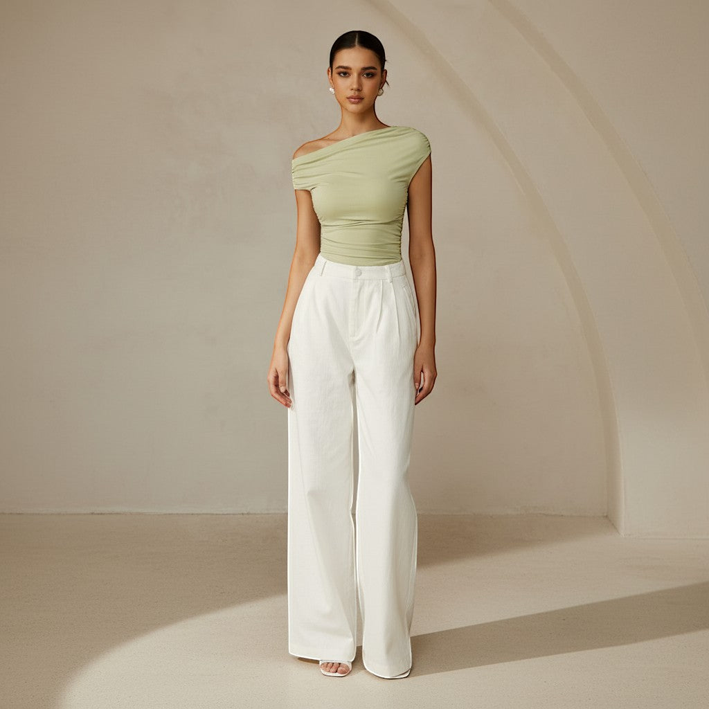 Yemelia light green ruched one-shoulder top with asymmetrical neckline and stretch fabric.