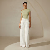 Yemelia light green ruched one-shoulder top with asymmetrical neckline and stretch fabric.