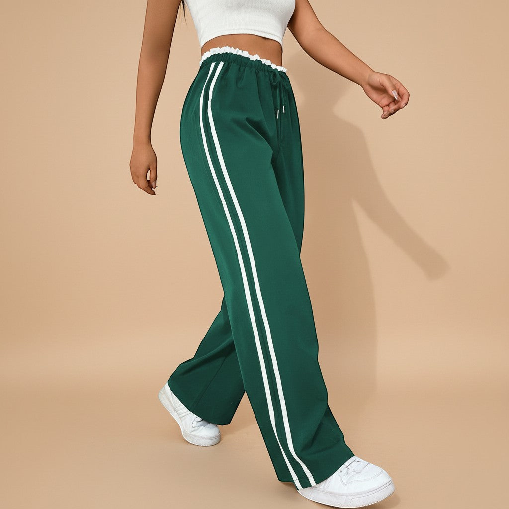 Yemelia high waist wide leg track pants in dark green with white side stripes and elastic waistband.