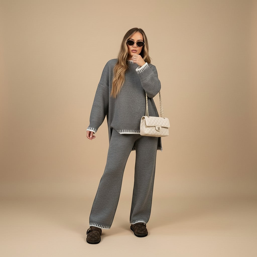Yemelia grey knit lounge set with crewneck sweater and wide-leg pants, featuring white contrast trim detailing.