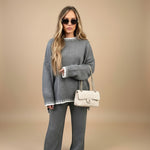 Yemelia grey knit sweater set with oversized top and wide leg pants, featuring contrast trim detail. Soft knit fabric.