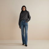 Yemelia grey knit turtleneck sweater with black contrast trim detailing on shoulders and sleeves. Relaxed fit.
