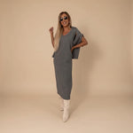 Yemelia grey knit turtleneck sweater and fitted midi skirt set, soft fabric, relaxed fit sweater, elegant silhouette.