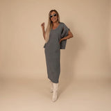 Yemelia grey knit turtleneck sweater and fitted midi skirt set, soft fabric, relaxed fit sweater, elegant silhouette.