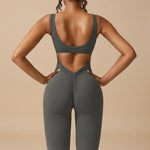 Yemelia grey sleeveless sculpting flared leg jumpsuit with ruched detail on the back.