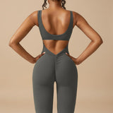 Yemelia grey sleeveless sculpting flared leg jumpsuit with ruched detail on the back.