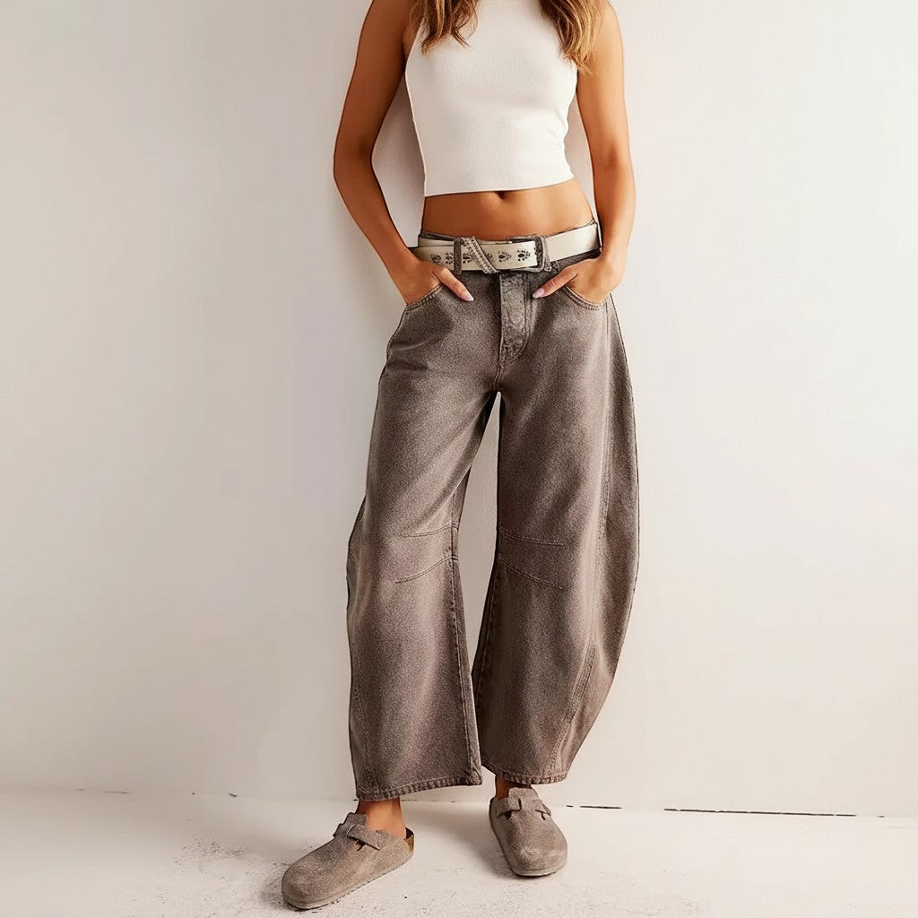 Yemelia grey wide leg denim jeans with relaxed fit and mid-rise waist. Durable denim construction with five-pocket styling.