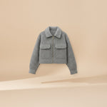 Yemelia grey structured cropped jacket with zip front, classic collar, and utility pockets. Made from a wool blend.