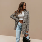 Yemelia double-breasted houndstooth blazer jacket with notched lapels and button front. Structured fit.