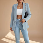 Yemelia light blue open front tailored blazer with slim fit and functional pockets.