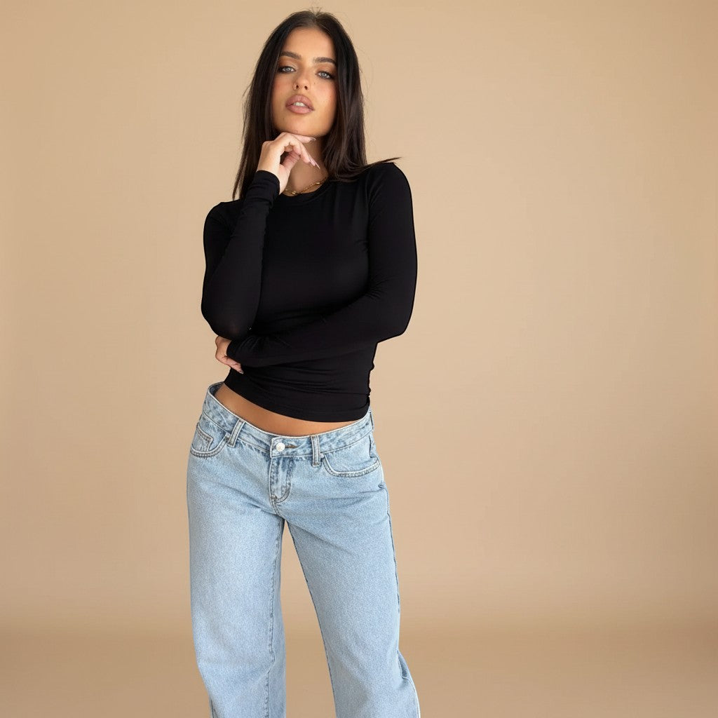 Yemelia light wash denim jeans with a low rise waist and relaxed wide leg fit. Classic five-pocket design.