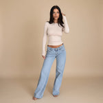 Yemelia light wash denim jeans with low rise waist and wide leg fit. Classic five-pocket design.