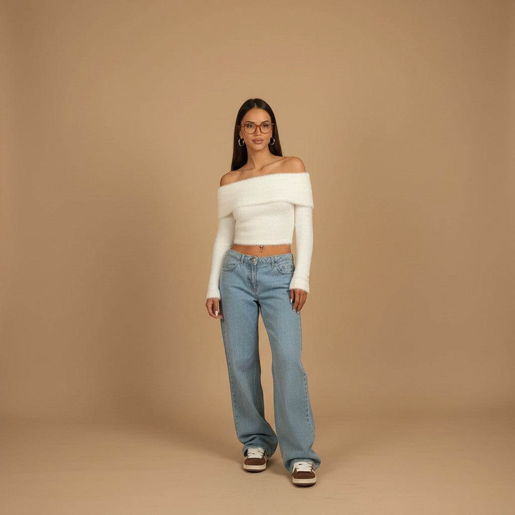 Yemelia light wash denim jeans with a mid-rise waist and wide leg silhouette, perfect for casual wear.