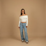Yemelia light wash denim jeans with a mid-rise waist and wide leg silhouette, perfect for casual wear.