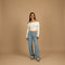 Yemelia light wash denim jeans with a mid-rise waist and wide leg silhouette, perfect for casual wear.