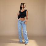Yemelia light wash denim jeans with a low rise waist and wide leg fit. Classic five-pocket design.