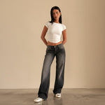 Yemelia mid rise wide leg denim jeans in a faded black wash with a relaxed fit and five-pocket design.