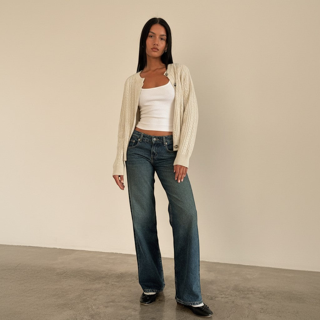 Yemelia mid rise wide leg denim jeans in a faded blue wash with a relaxed fit and five-pocket design.