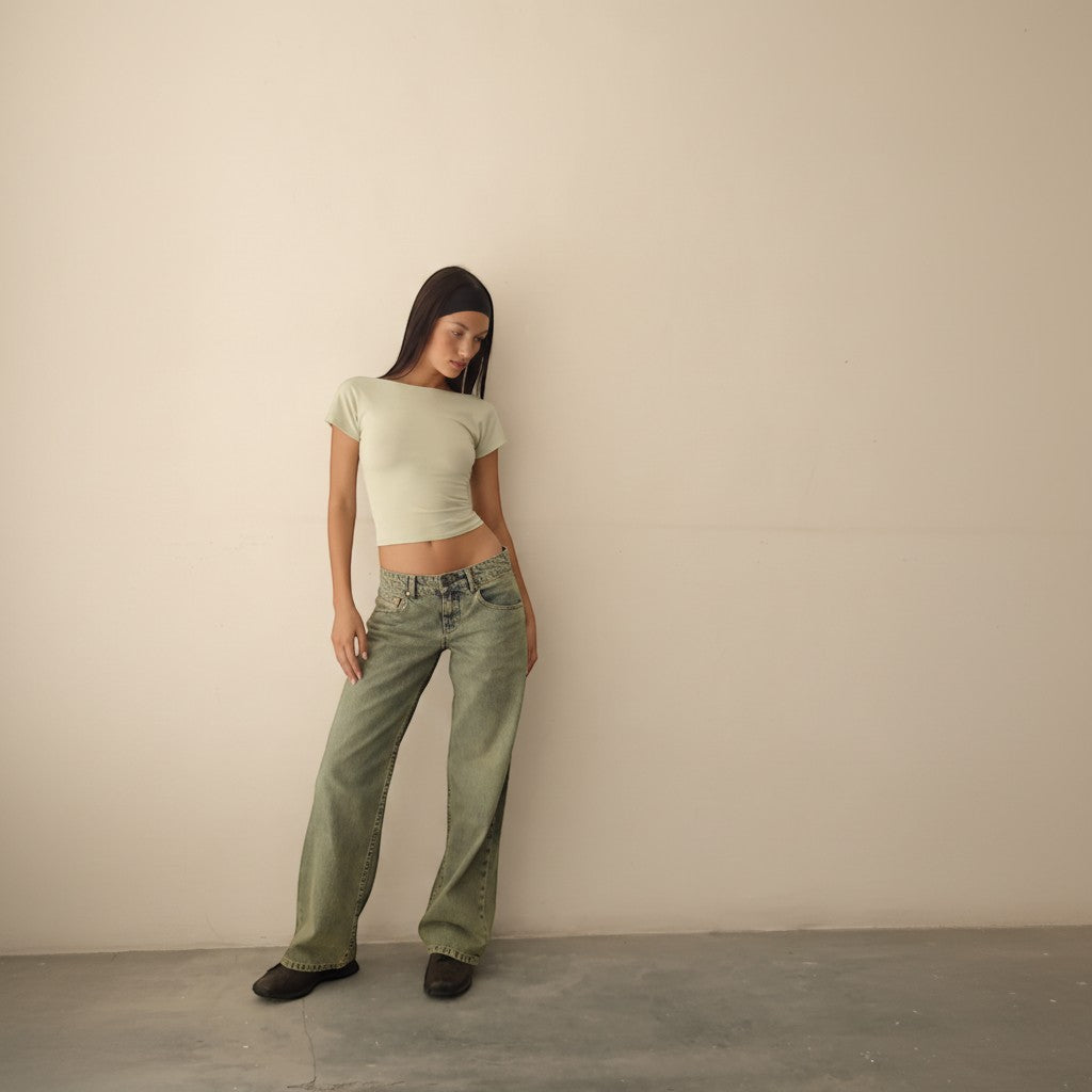 Yemelia mid rise wide leg denim jeans in a faded green wash with a relaxed fit and five-pocket design.