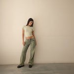 Yemelia mid rise wide leg denim jeans in a faded green wash with a relaxed fit and five-pocket design.