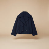 Yemelia navy blue cropped double-breasted jacket with wide lapels and decorative buttons.