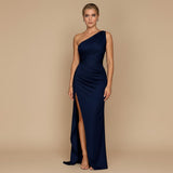 Yemelia navy blue one shoulder draped evening gown with high slit and floor-length silhouette.