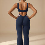 Yemelia navy blue sleeveless sculpting flared leg jumpsuit with ruched detail on the back.