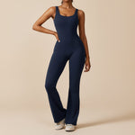 Yemelia navy blue sleeveless sculpting flared leg jumpsuit made of smooth stretch fabric.