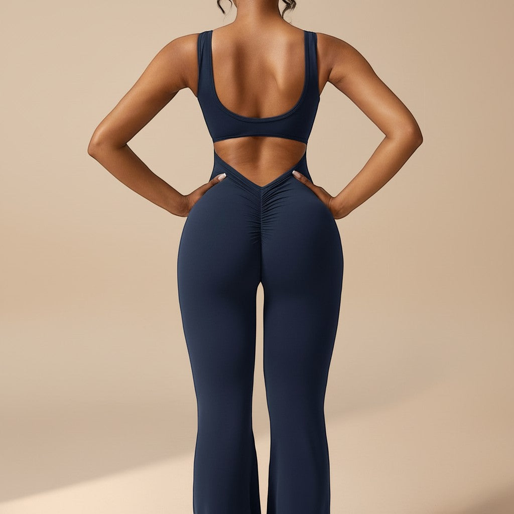 Yemelia navy blue sleeveless sculpting jumpsuit with ruched back detail and flared legs.