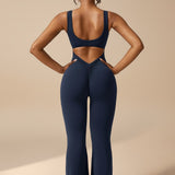 Yemelia navy blue sleeveless sculpting jumpsuit with ruched back detail and flared legs.