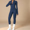 Yemelia navy blue long sleeve zip front sculpting one piece jumpsuit with full-length legs and high neckline.